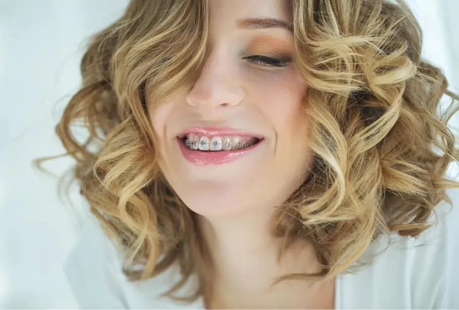 Woman smiling with dental braces
