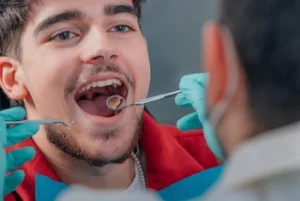 dentist checking a patient's mouth
