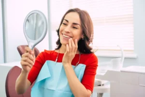 woman smiling happily in the mirror