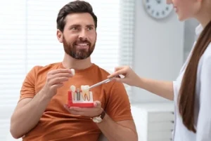 patient consulting a dentist about implant retained dentures